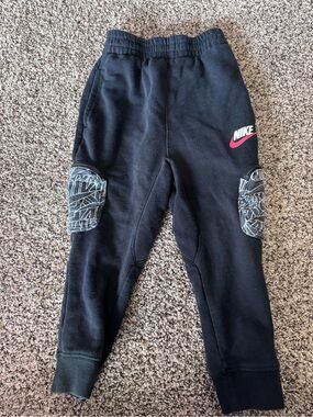 Nike 3-4years Black Joggers with Graphic Knee Patches and Pink Swoosh